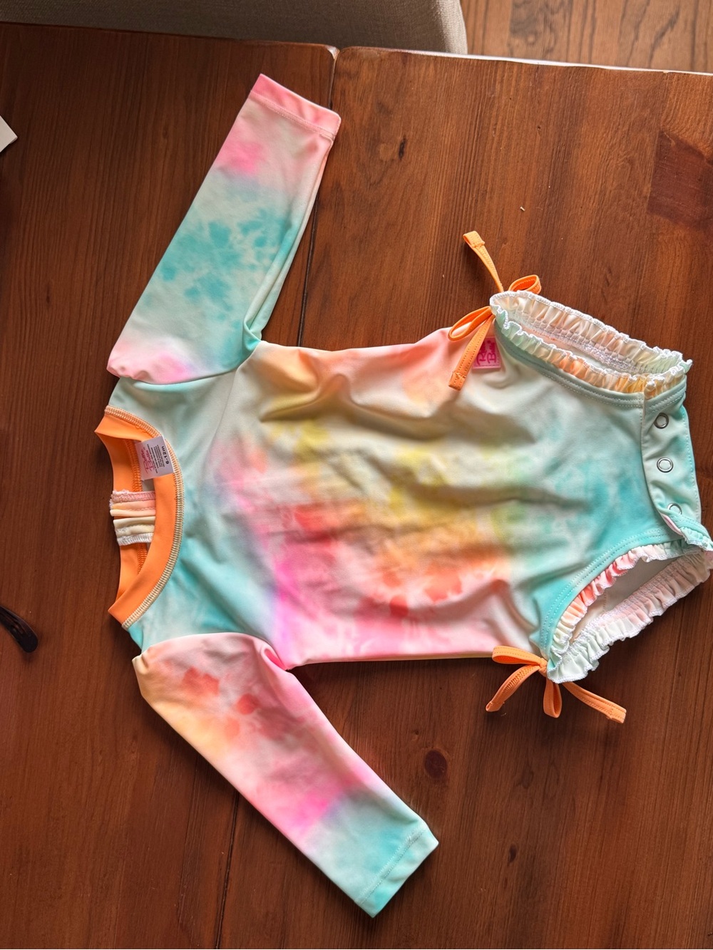 Ruffle Butts Orange Trim Pastel Tie-Dye swimsuit